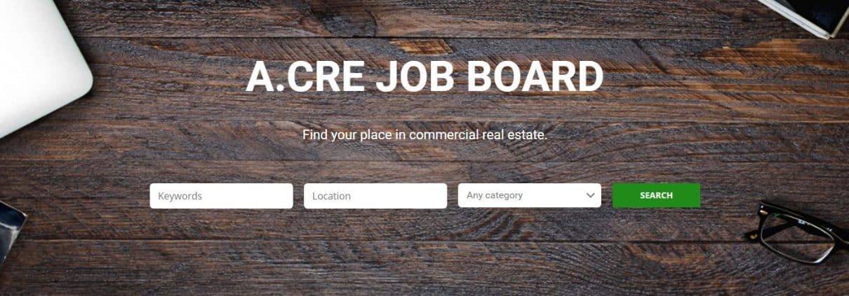 the adventures in cre job board with search box, wood desktop background, and title